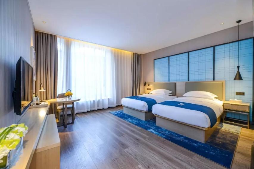 Echarm Hotel Ji'Nan Railway Station Jinan Esterno foto